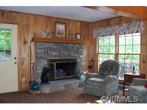 477 Rocky Top Road Maggie Valley, NC 28751 - Photo 7 of 20 a living room with furniture and a fireplace