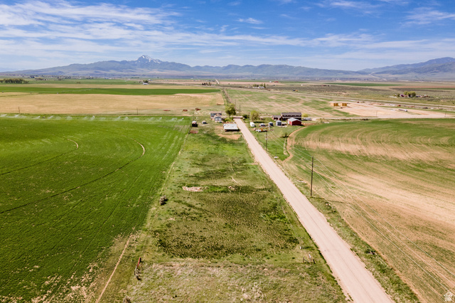 19994 South Olson Road Downey, ID 83234 - Photo 44 of 49 Overview of rural landscape featuring a mountain backdrop and rows of crops