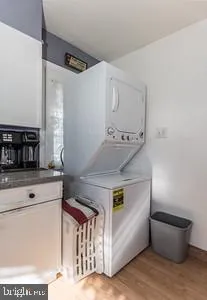a kitchen with stainless steel appliances granite countertop a stove and a refrigerator