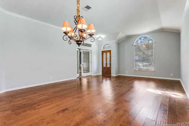 a view of a livingroom with wooden floor
