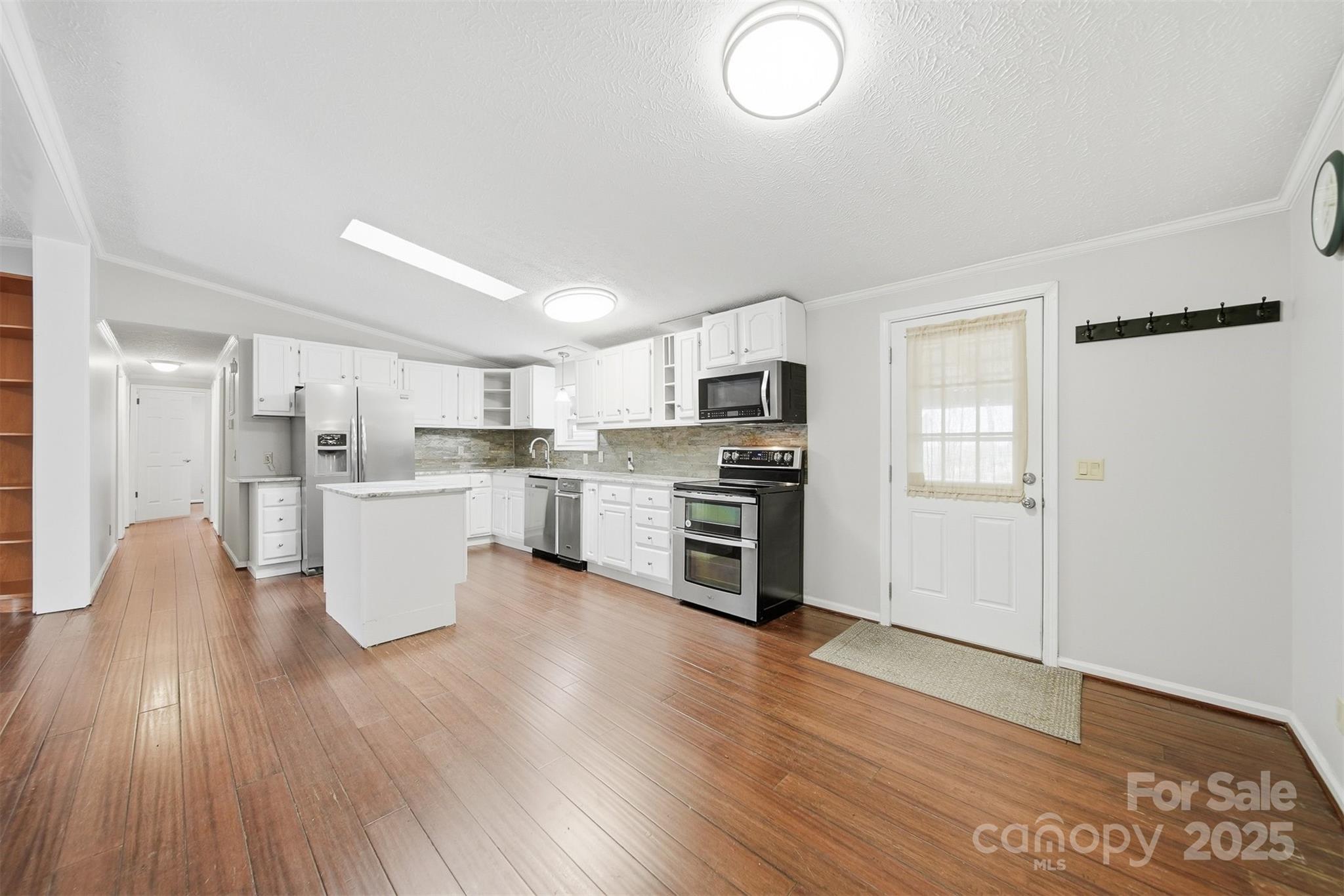 4915 Quartz Ridge Road Maiden, NC 28650 - Photo 11 of 38 a view of kitchen with wooden floor