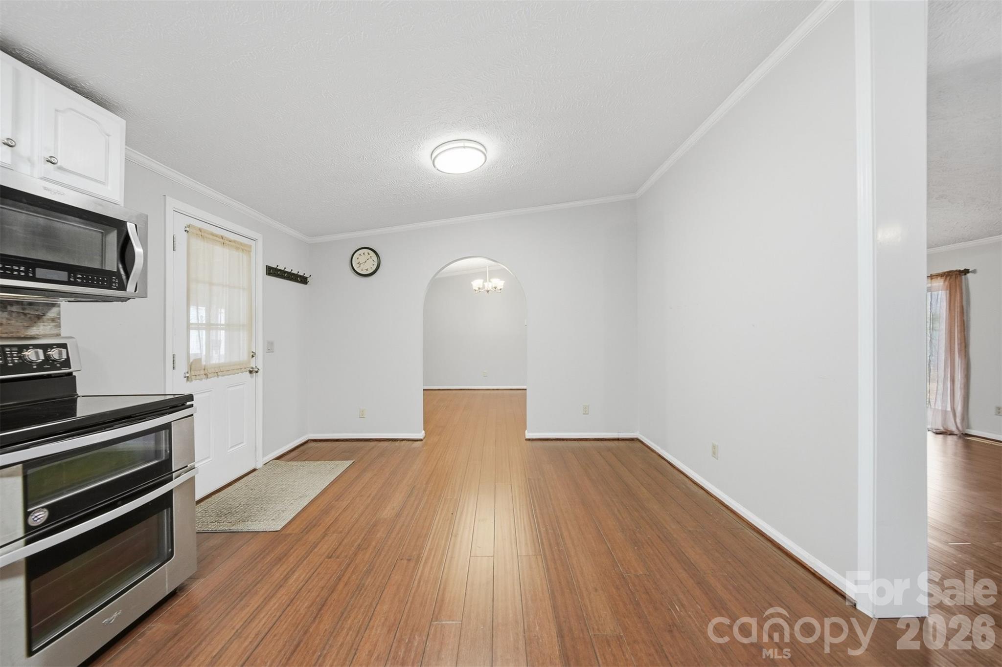 4915 Quartz Ridge Road Maiden, NC 28650 - Photo 13 of 38 a view of a kitchen with wooden floor and electronic appliances