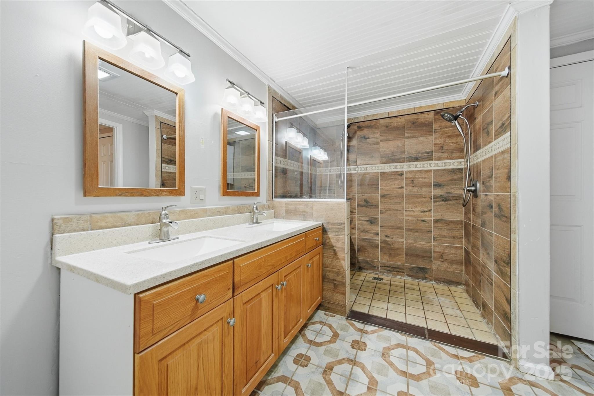 4915 Quartz Ridge Road Maiden, NC 28650 - Photo 18 of 38 a bathroom with a shower sink and mirror