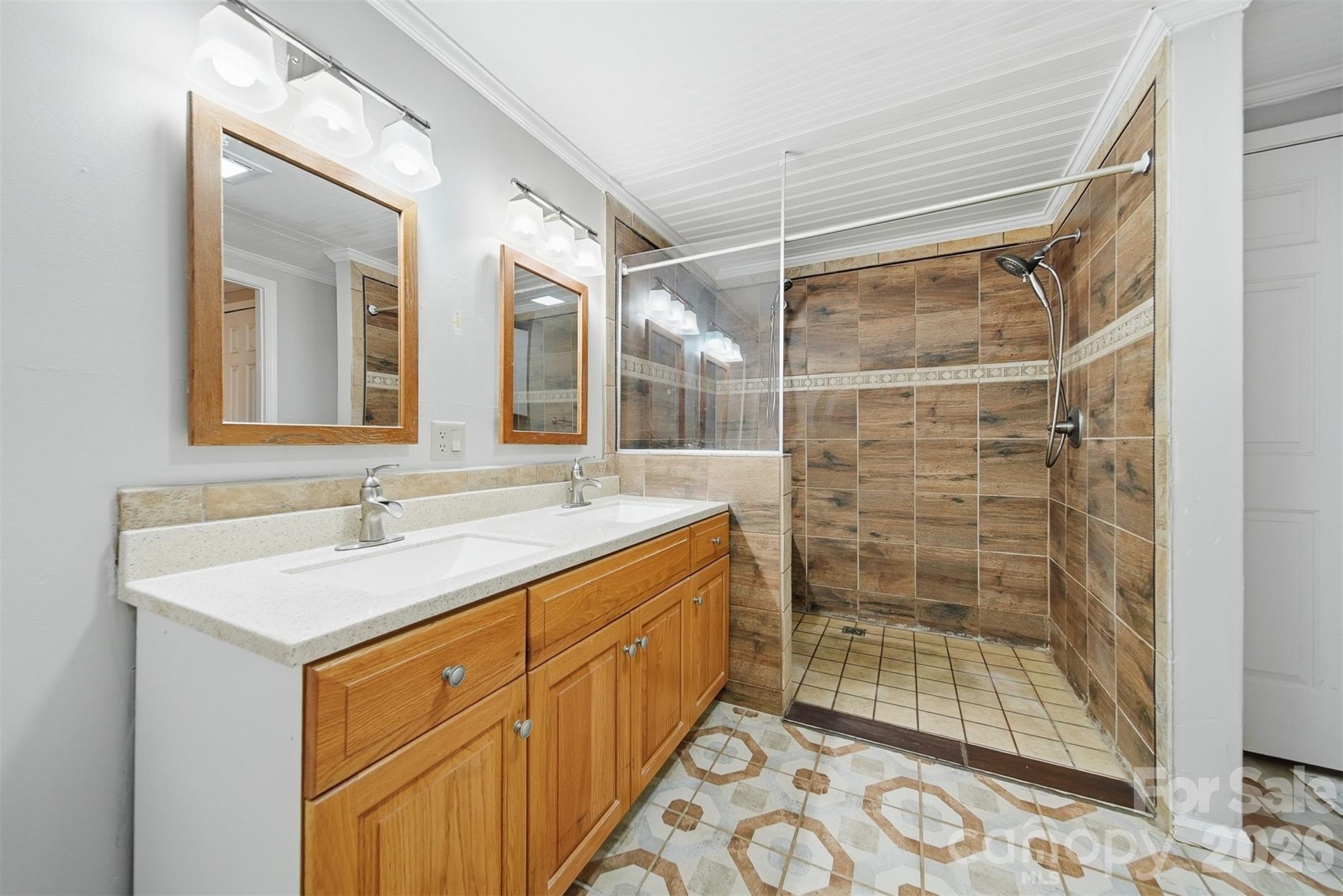 4915 Quartz Ridge Road Maiden, NC 28650 - Photo 18 of 38 a bathroom with a shower sink and mirror