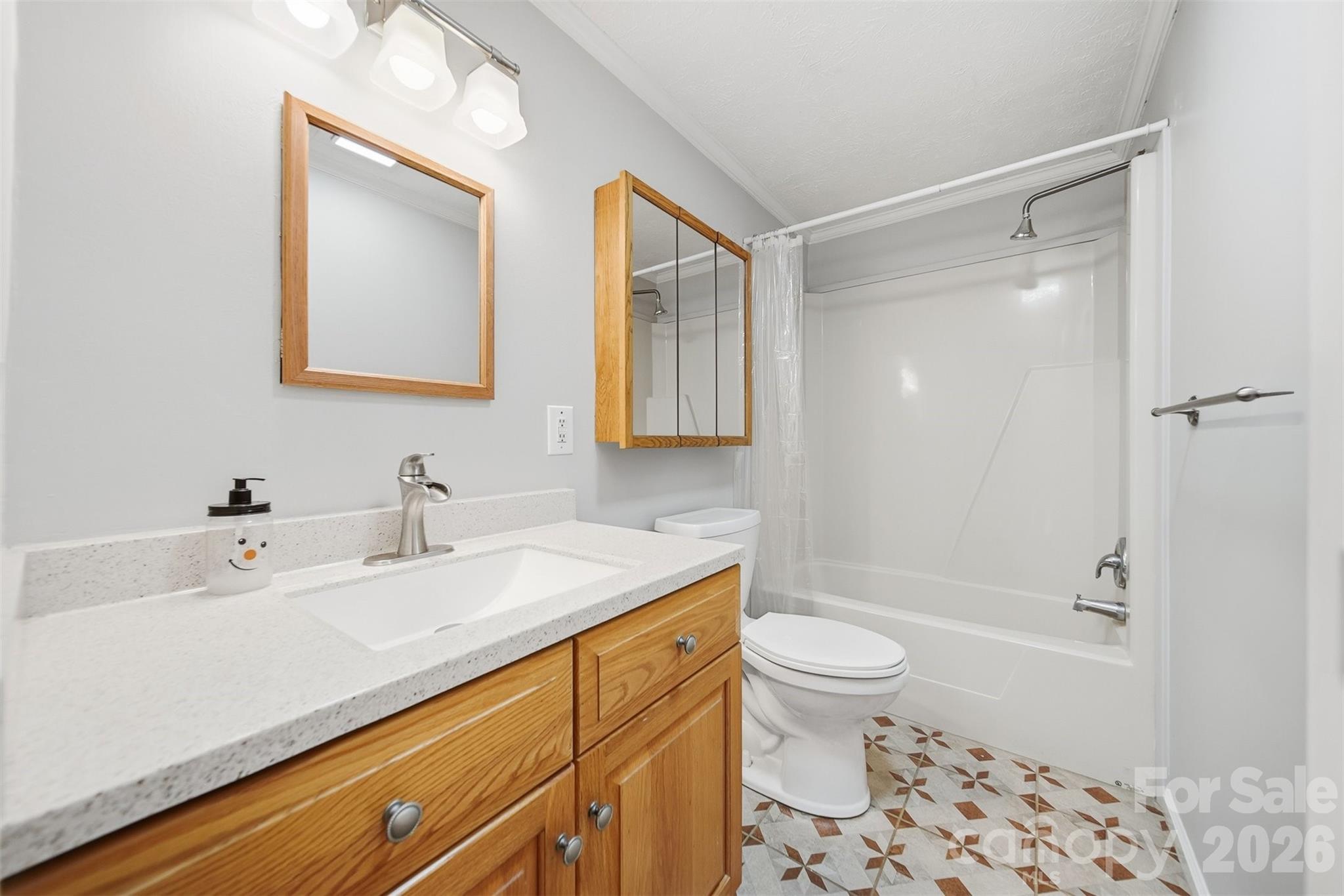 4915 Quartz Ridge Road Maiden, NC 28650 - Photo 22 of 38 a bathroom with a sink a toilet and shower