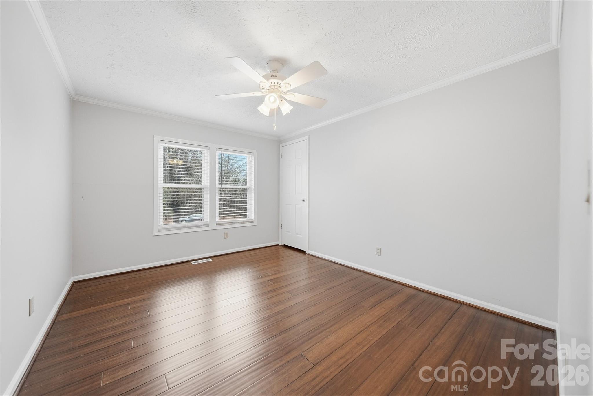 4915 Quartz Ridge Road Maiden, NC 28650 - Photo 23 of 38 wooden floor in an empty room with a window