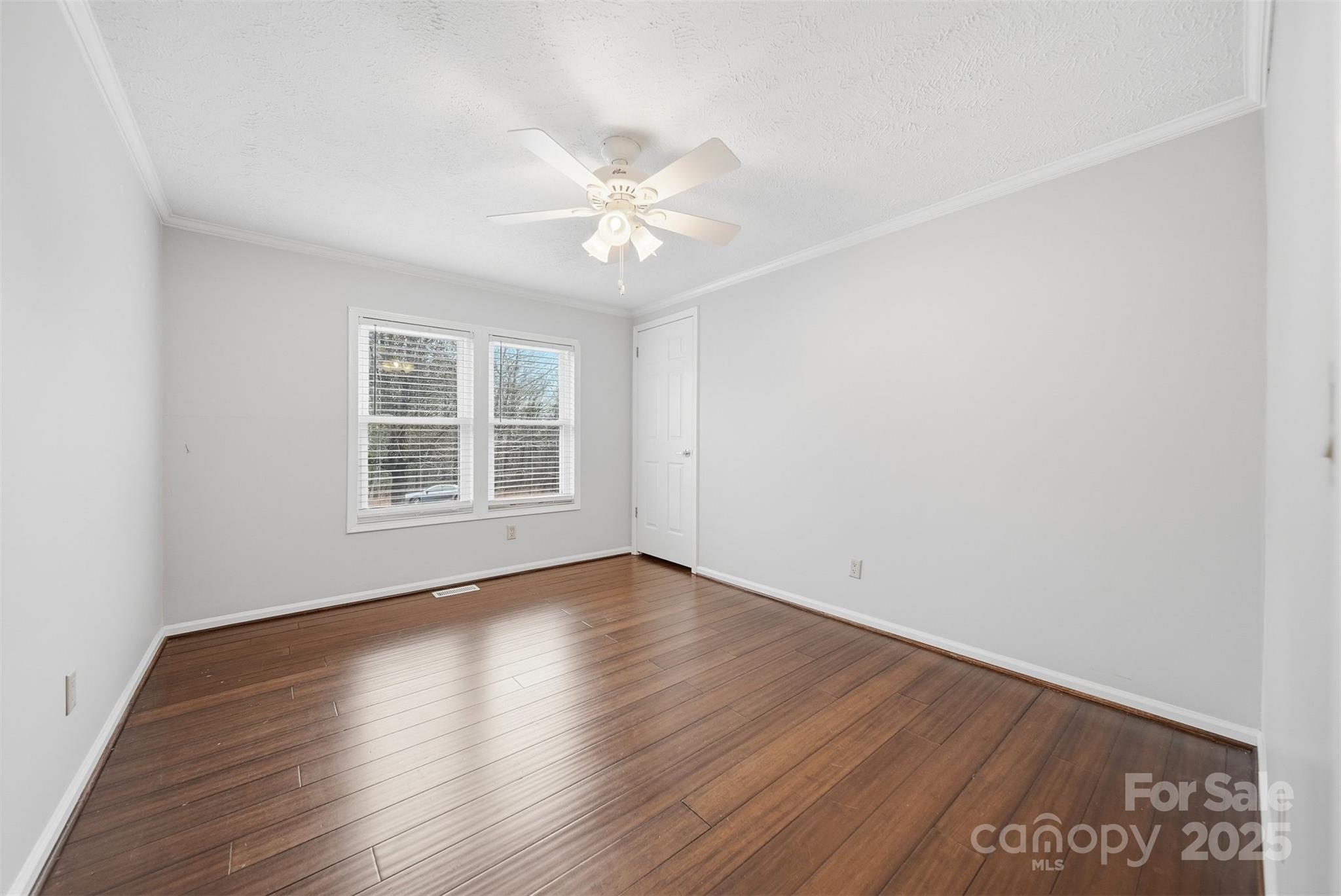 4915 Quartz Ridge Road Maiden, NC 28650 - Photo 23 of 38 wooden floor in an empty room with a window