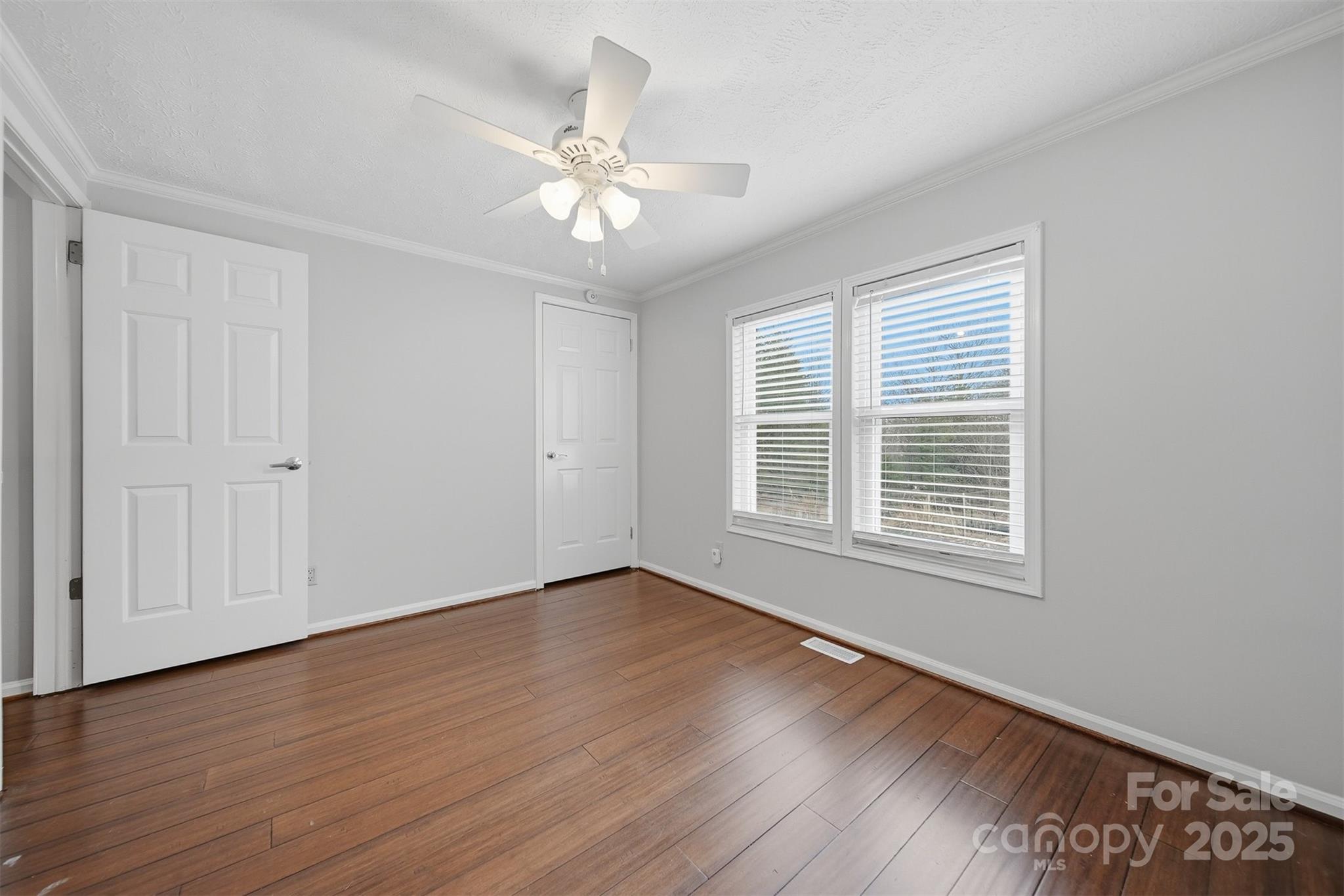4915 Quartz Ridge Road Maiden, NC 28650 - Photo 26 of 38 a view of an empty room with wooden floor and a window