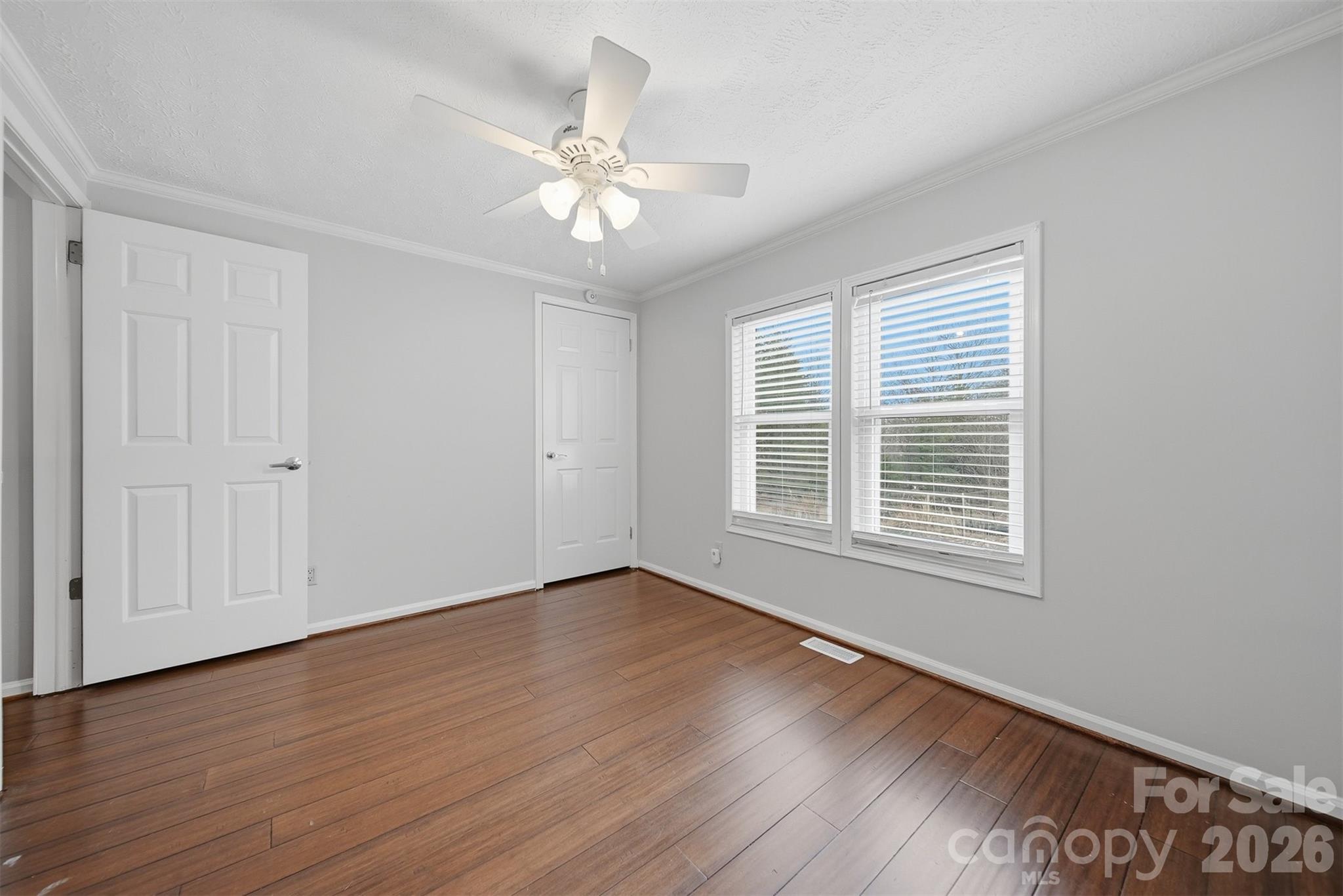 4915 Quartz Ridge Road Maiden, NC 28650 - Photo 27 of 38 a view of an empty room with wooden floor and a window