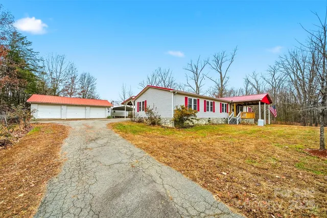 a front view of house with yard and seating area