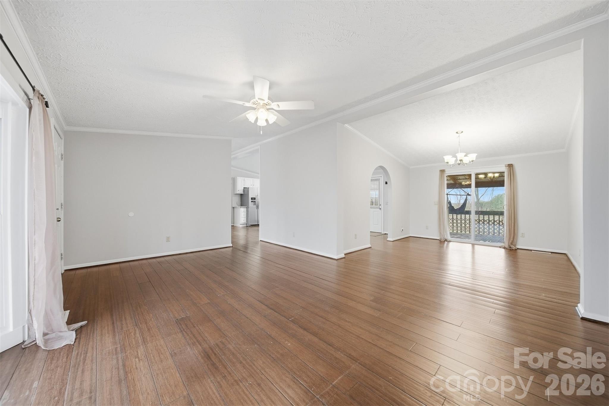4915 Quartz Ridge Road Maiden, NC 28650 - Photo 7 of 38 an empty room with wooden floor and windows