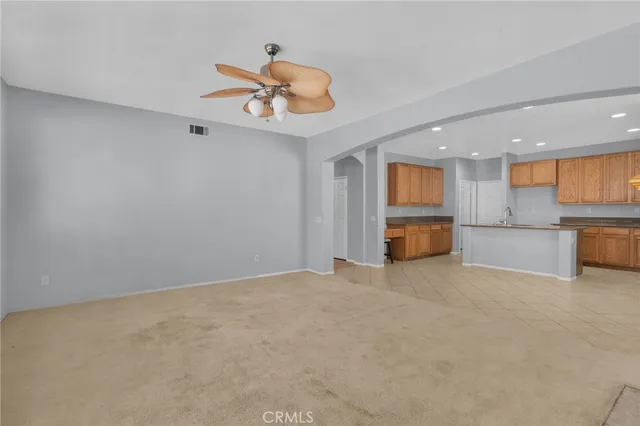 a view of a kitchen with a sink and a refrigerator