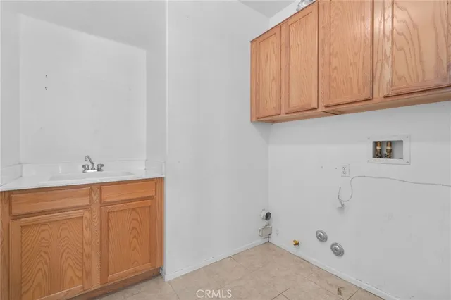 a bathroom with a sink and cabinets