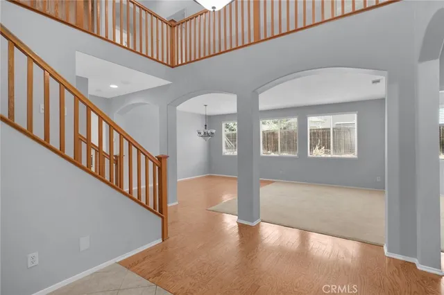 a view of an entryway with wooden floor