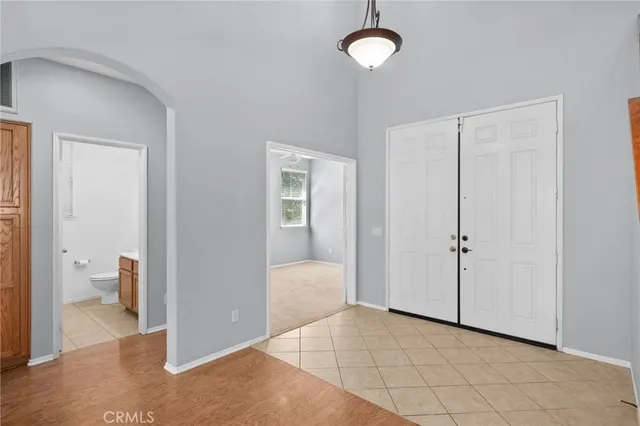 a view of a room with wooden floor and bathroom view