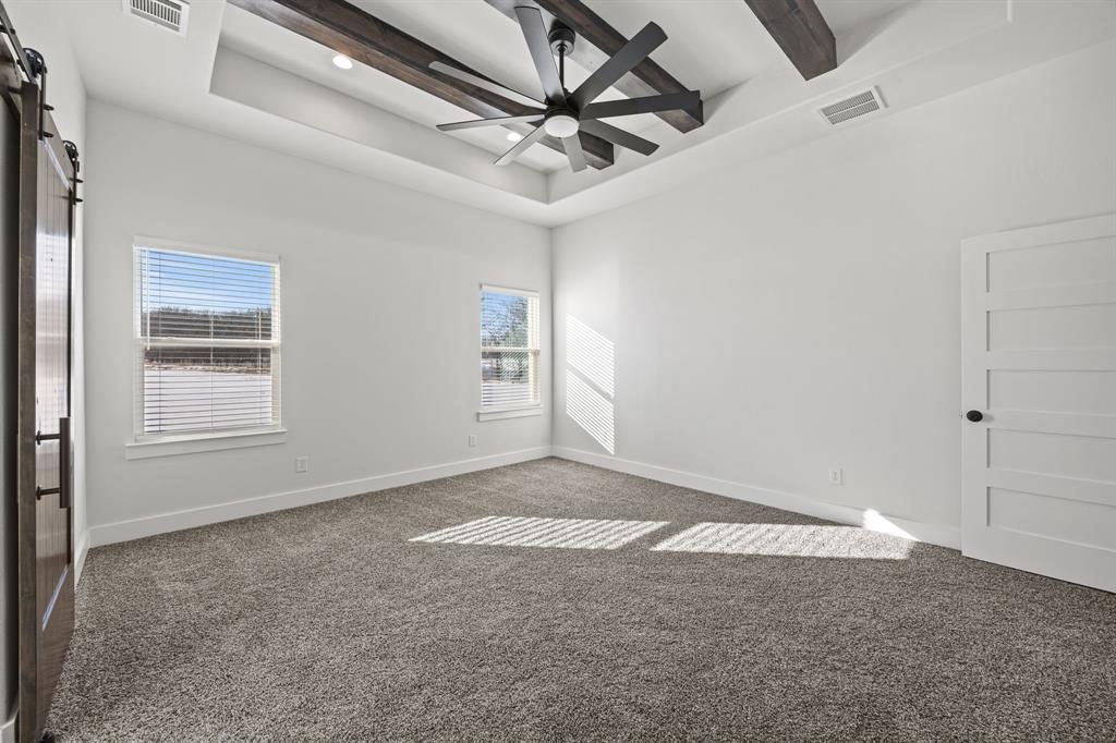 73 Dove Landing Rd Valley View Valley View, TX 76272 - Photo 16 of 30 Carpeted empty room featuring a tray ceiling and recessed lighting