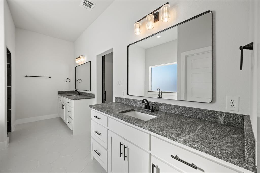 73 Dove Landing Rd Valley View Valley View, TX 76272 - Photo 18 of 30 Full bath with two vanities and light tile patterned floors