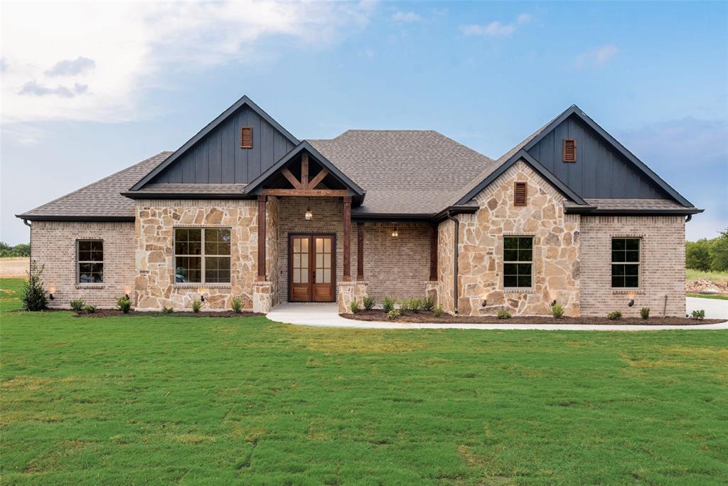 73 Dove Landing Rd Valley View Valley View, TX 76272 - Photo 2 of 34 Craftsman-style house with board and batten siding, stone siding, a front lawn, and a porch
