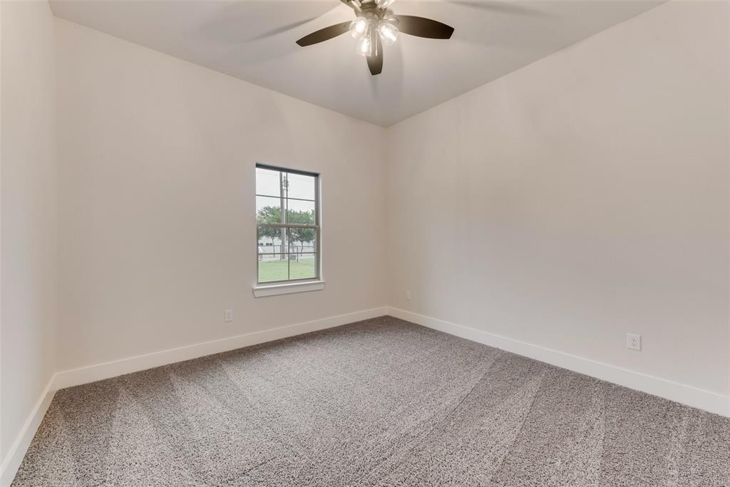 73 Dove Landing Rd Valley View Valley View, TX 76272 - Photo 22 of 34 Spare room featuring light carpet and ceiling fan