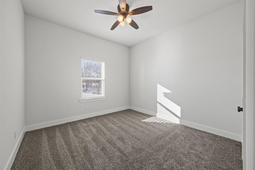 73 Dove Landing Rd Valley View Valley View, TX 76272 - Photo 22 of 30 Spare room featuring carpet floors and ceiling fan