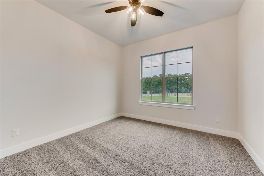 73 Dove Landing Rd Valley View Valley View, TX 76272 - Photo 25 of 34 Empty room featuring carpet and a ceiling fan