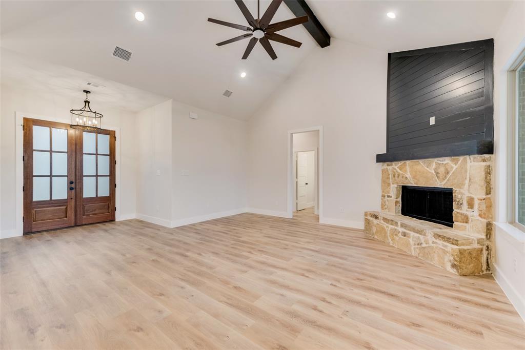 73 Dove Landing Rd Valley View Valley View, TX 76272 - Photo 6 of 34 Unfurnished living room with beam ceiling, high vaulted ceiling, light wood-style flooring, recessed lighting, and a ceiling fan