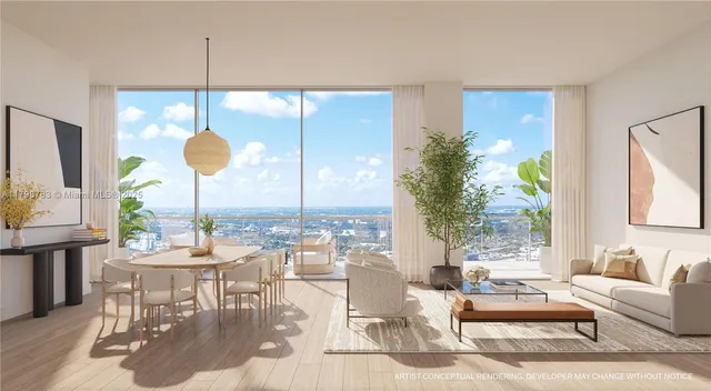 a very nice looking living room with a large window and dining table