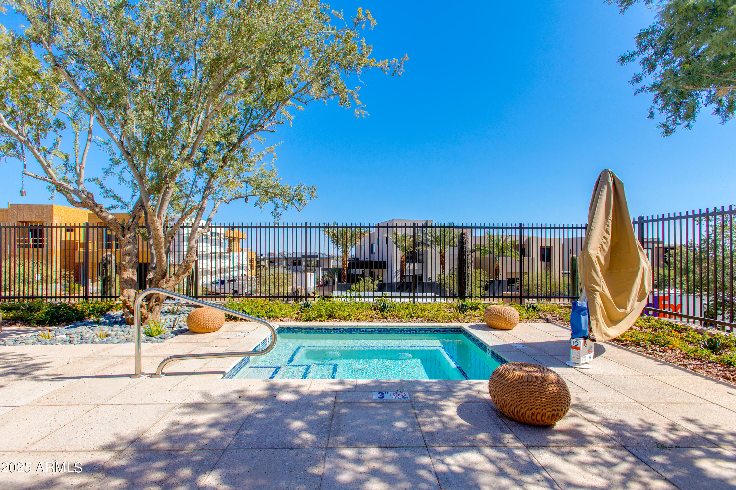 5000 North Camelback Ridge Drive, Unit 206 Scottsdale, AZ 85251 - Photo 47 of 62 a view of a swimming pool with a patio