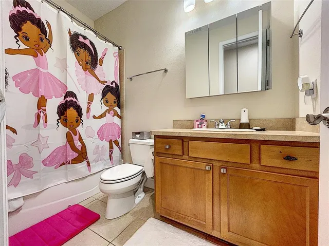 a view of a livingroom with workspace and a couch