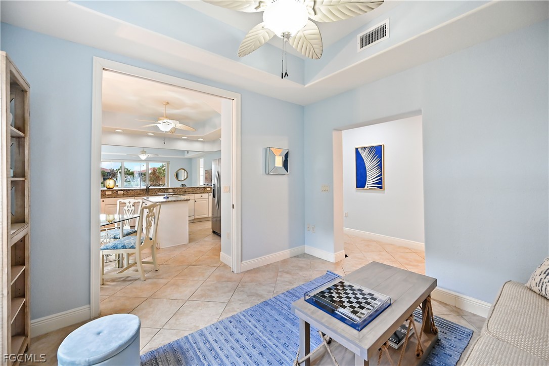 7832 Hawthorne Drive, Unit 1901 Naples, FL 34113 - Photo 12 of 26 a living room with a couch and a table