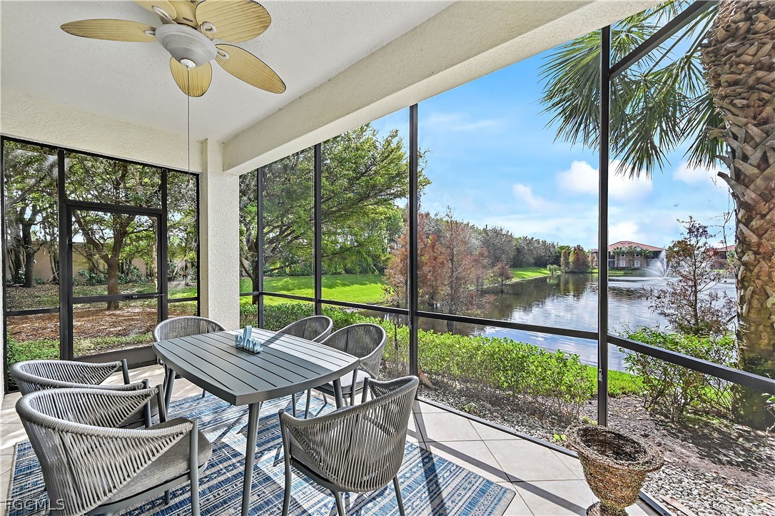 7832 Hawthorne Drive, Unit 1901 Naples, FL 34113 - Photo 20 of 26 a view of a patio with a table chairs and a potted plant