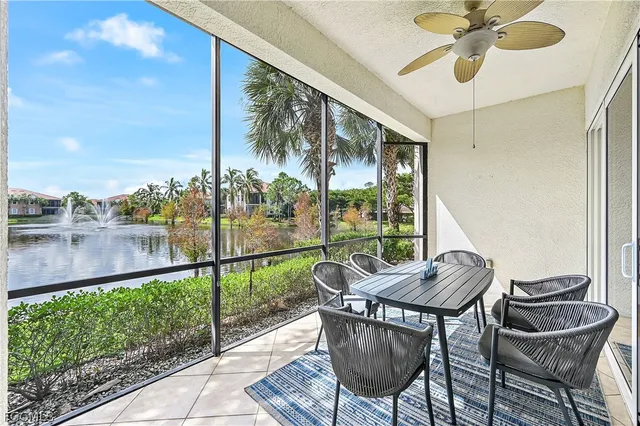 a patio with yard glass top table and chairs