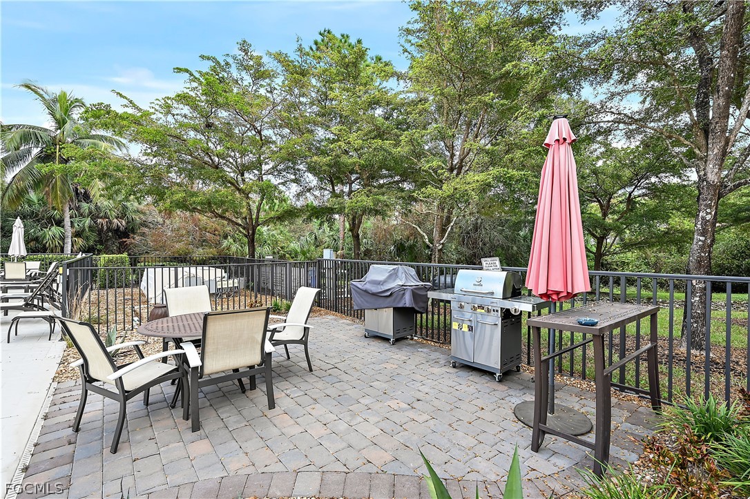 7832 Hawthorne Drive, Unit 1901 Naples, FL 34113 - Photo 25 of 26 a view of a sitting area with furniture and wooden deck