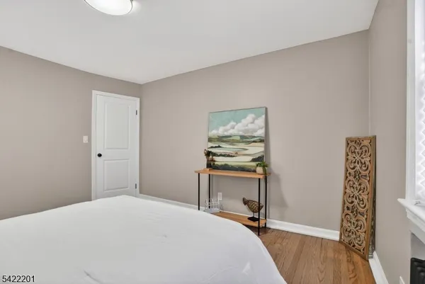a bedroom with a bed and a table in it