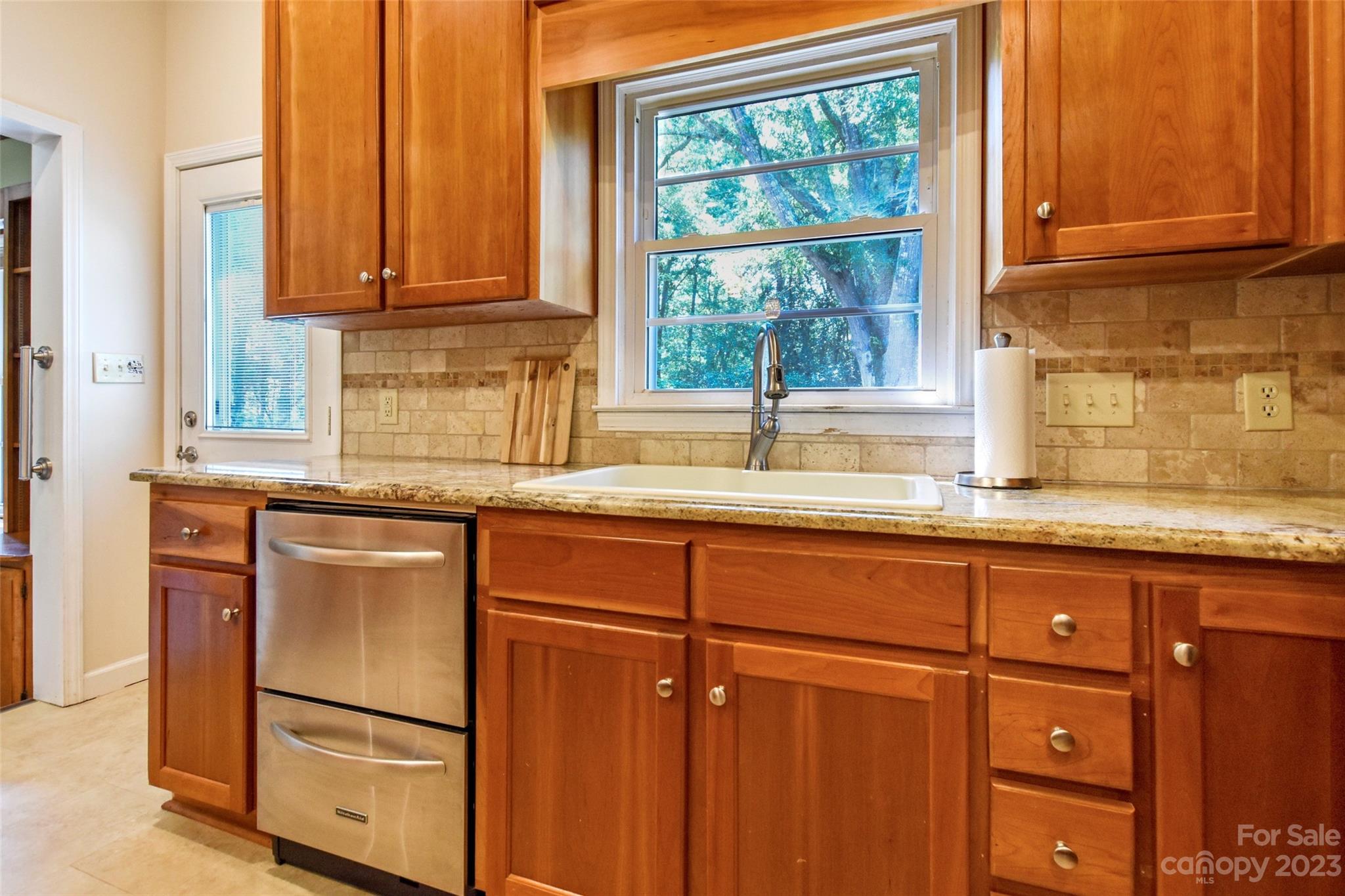 3199 Greenwood Road Rock Hill, SC 29730 - Photo 16 of 33 a kitchen with granite countertop cabinets stainless steel appliances and a window