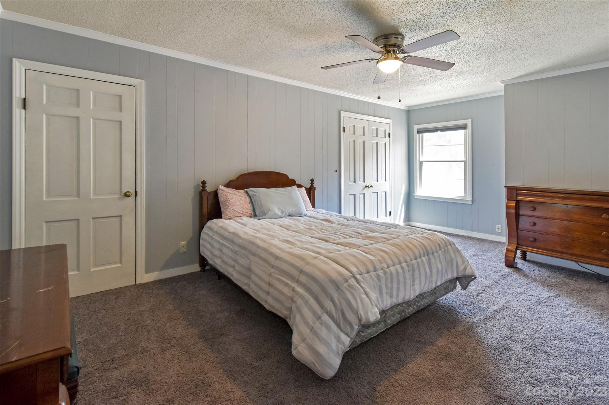 3199 Greenwood Road Rock Hill, SC 29730 - Photo 23 of 33 a bedroom with a bed and a ceiling fan