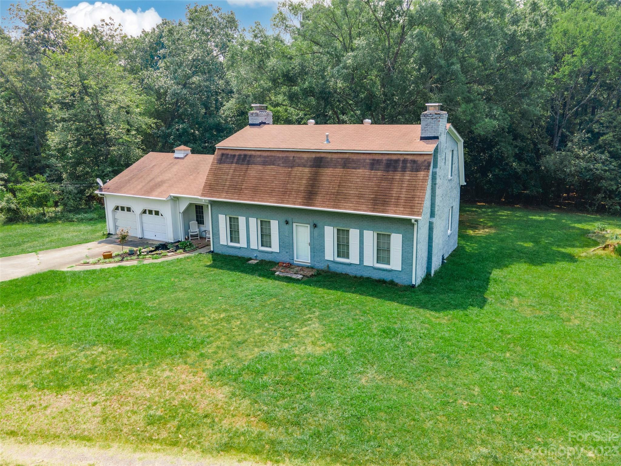 3199 Greenwood Road Rock Hill, SC 29730 - Photo 32 of 33 a view of a house with a yard table and chairs