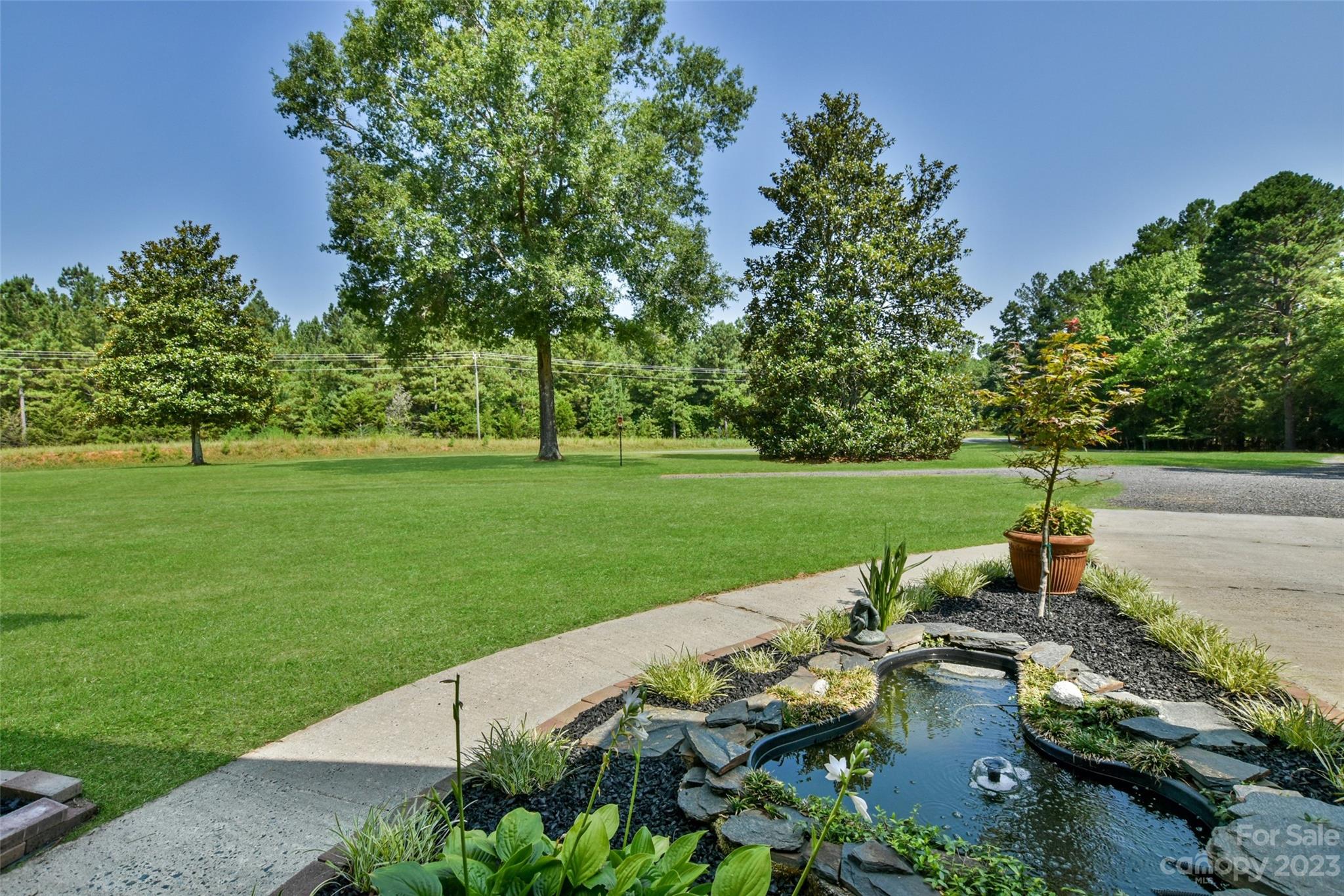 3199 Greenwood Road Rock Hill, SC 29730 - Photo 4 of 33 a view of a garden with lawn chairs