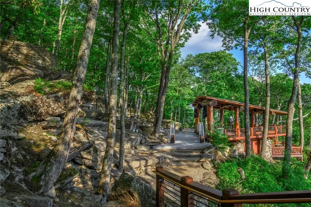a view of a chairs and table on the deck