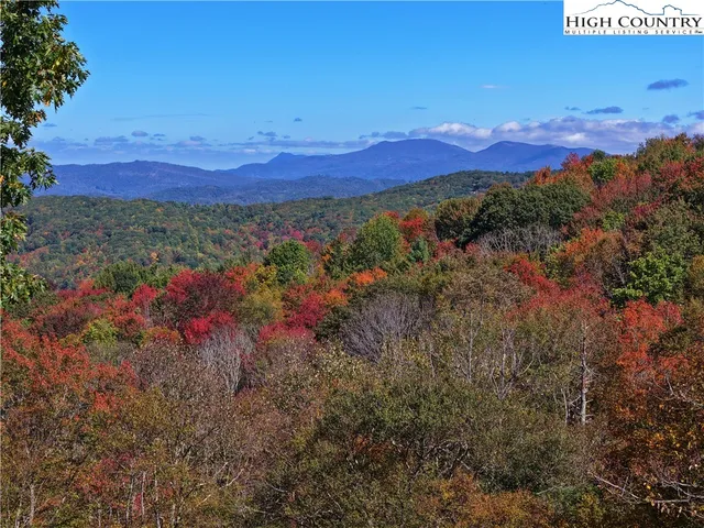 a view of a city with mountains in the background
