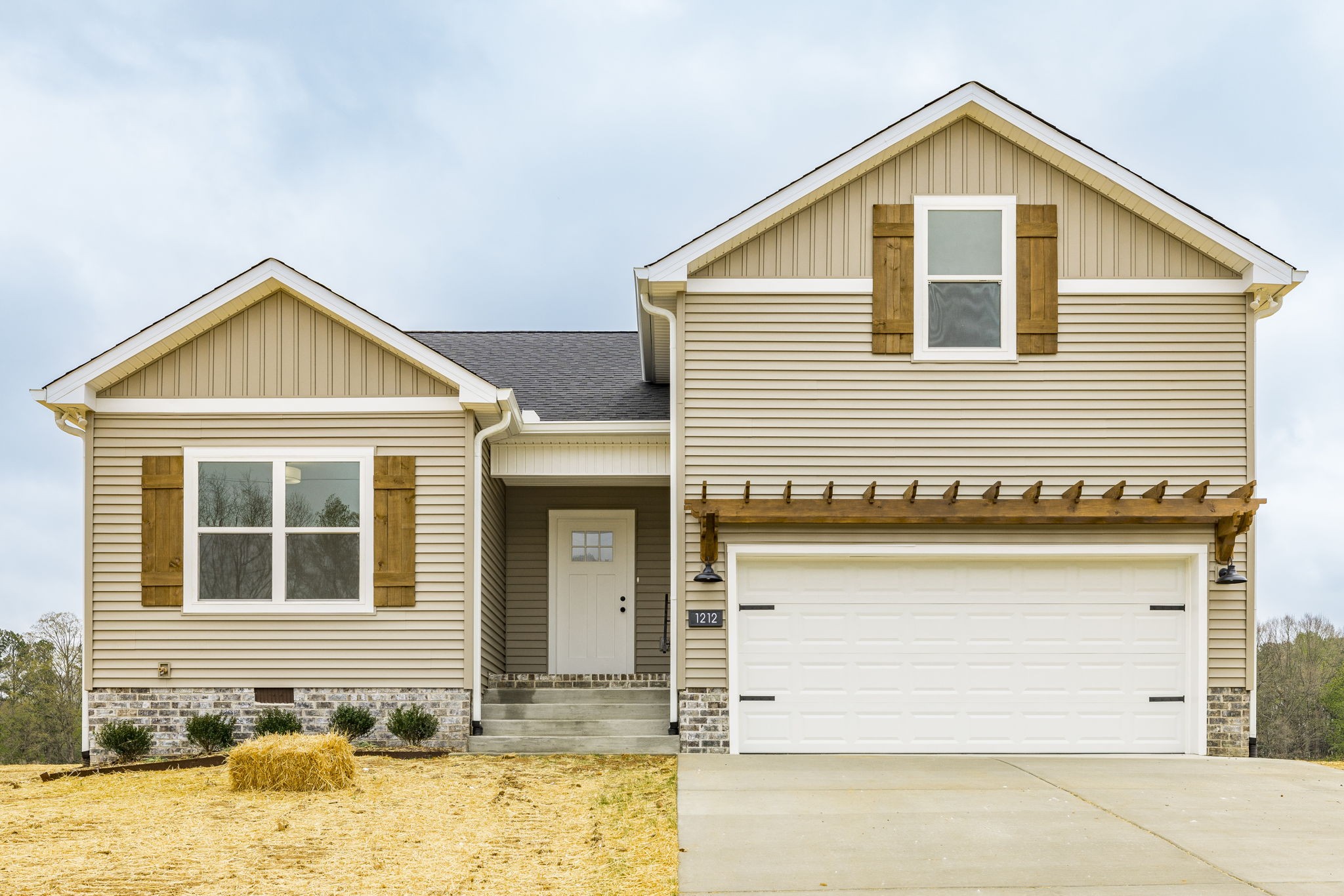 a view of a house with wooden fence