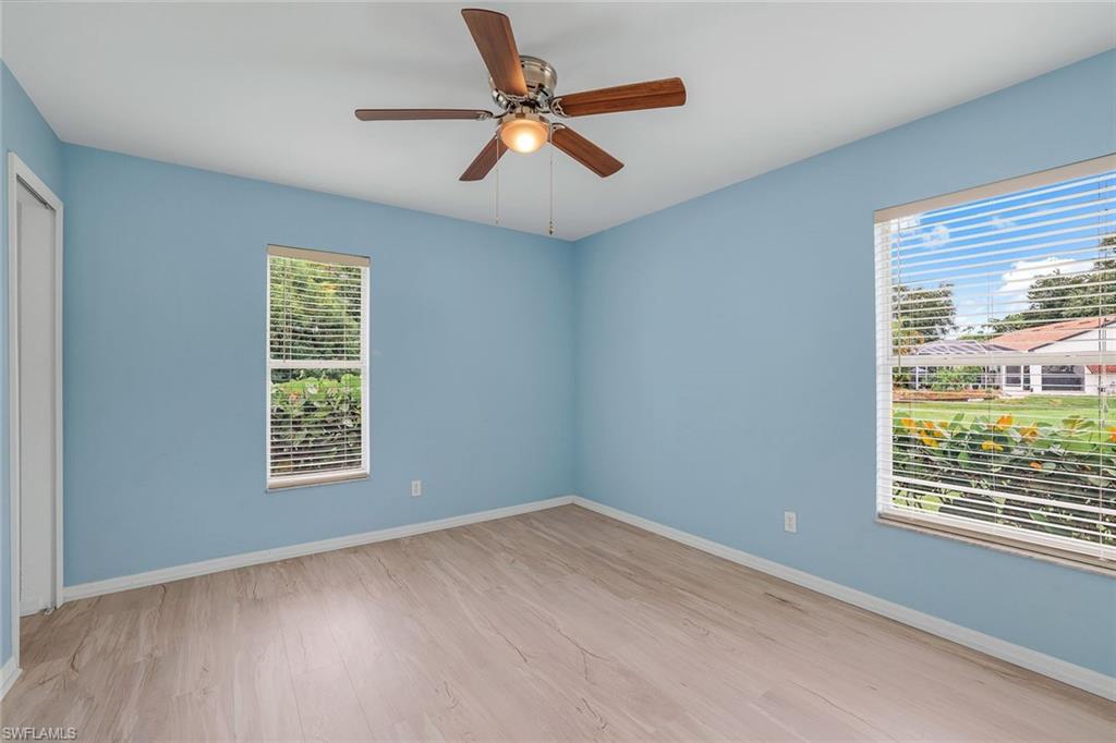 7786 Scarlet Court Naples, FL 34104 - Photo 17 of 19 a view of an empty room with a window