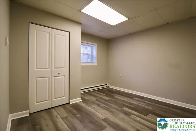 an empty room with wooden floor