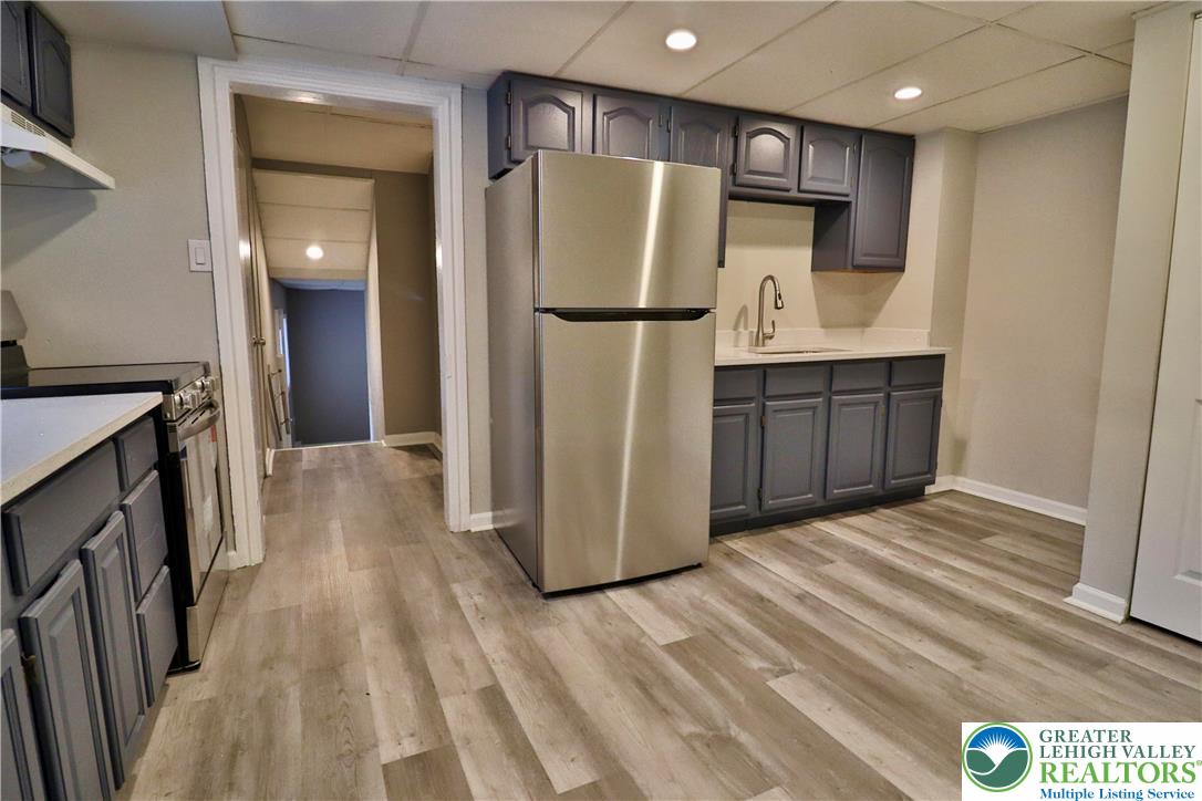 28 West Raspberry Street, Unit 2 Bethlehem, PA 18018 - Photo 2 of 13 a kitchen with stainless steel appliances a refrigerator and a sink