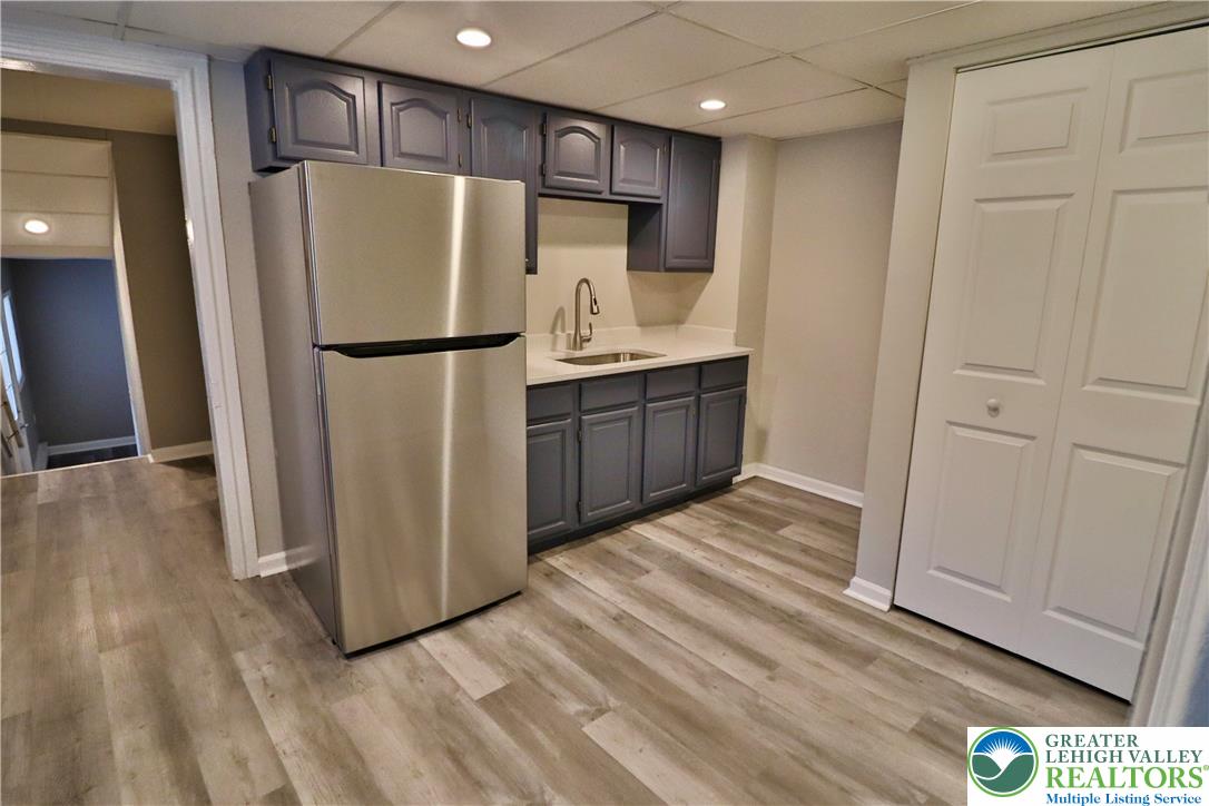 28 West Raspberry Street, Unit 2 Bethlehem, PA 18018 - Photo 3 of 13 a kitchen with stainless steel appliances a refrigerator and wooden floor