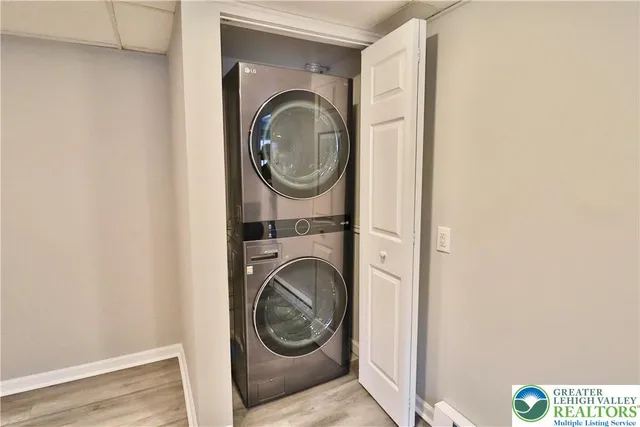 a view of a hallway with washer and dryer