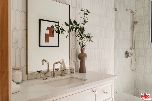 a bathroom with a sink and mirror