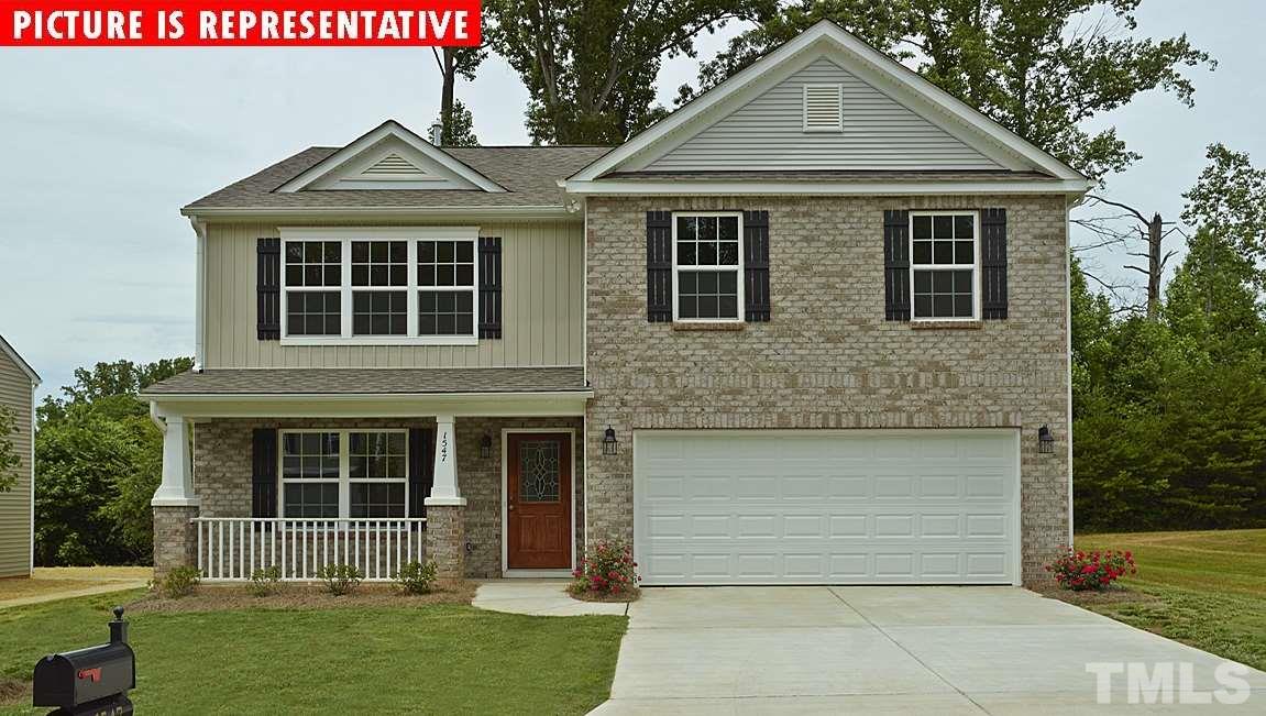 3620 Marble Ridge Lane Raleigh, NC 27610 - Photo 1 of 1 a front view of a house with a yard