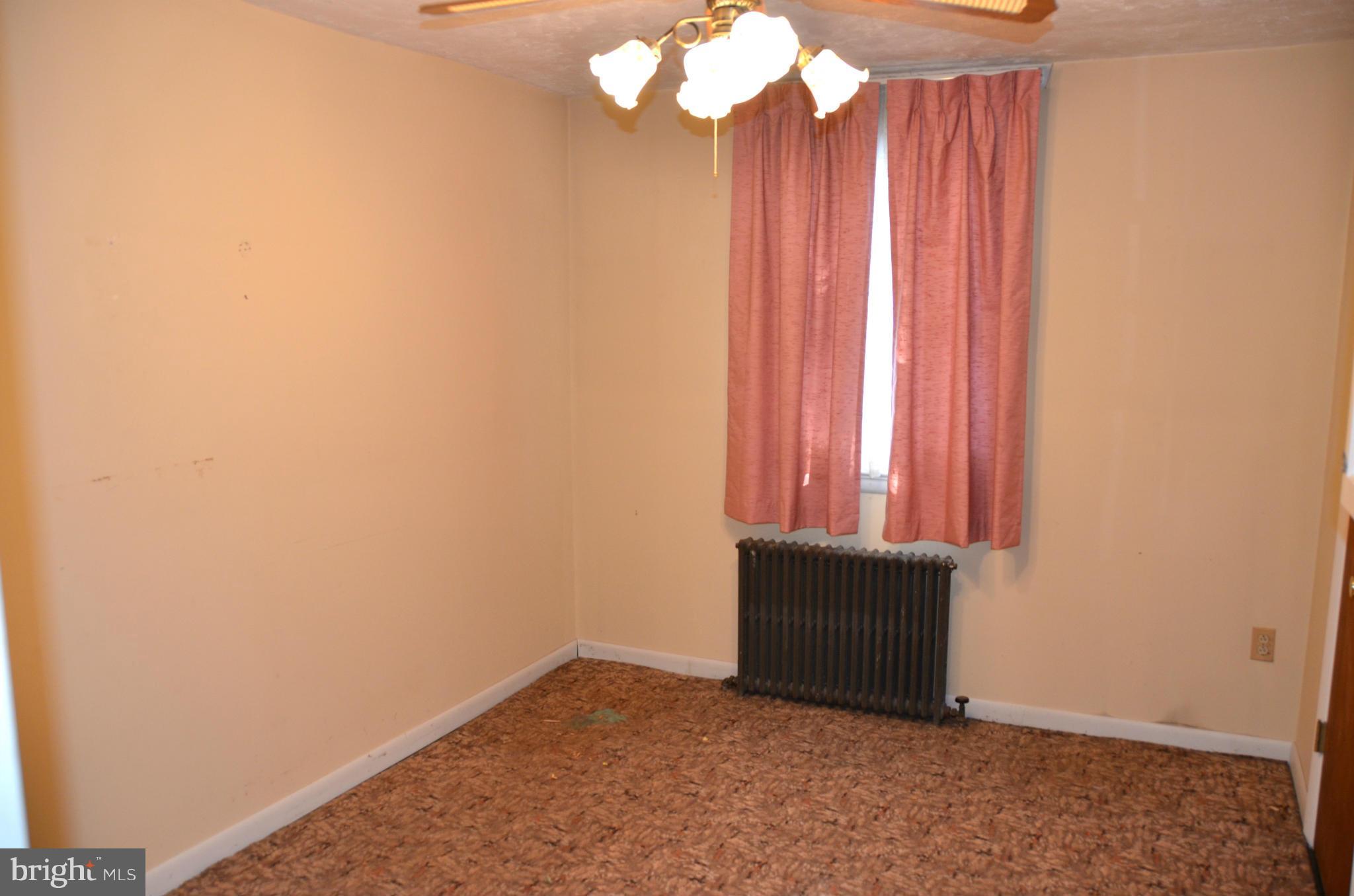 1637 Hilltop Road Edgewater, MD 21037 - Photo 8 of 20 a view of a small space with wooden floor and a window