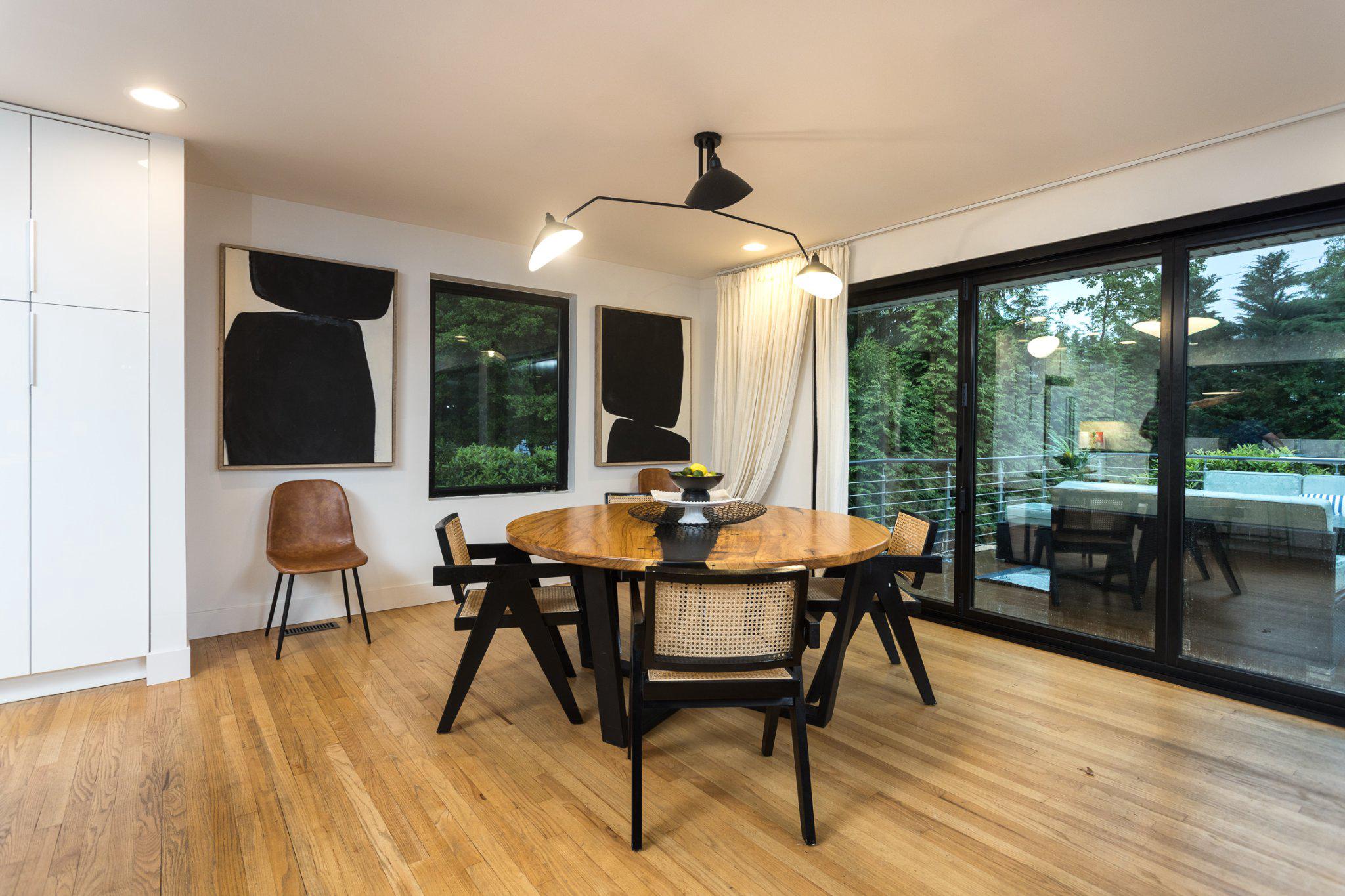7006 Copeleigh Road Baltimore, MD 21212 - Photo 10 of 43 a dining room with furniture wooden floor and a chandelier